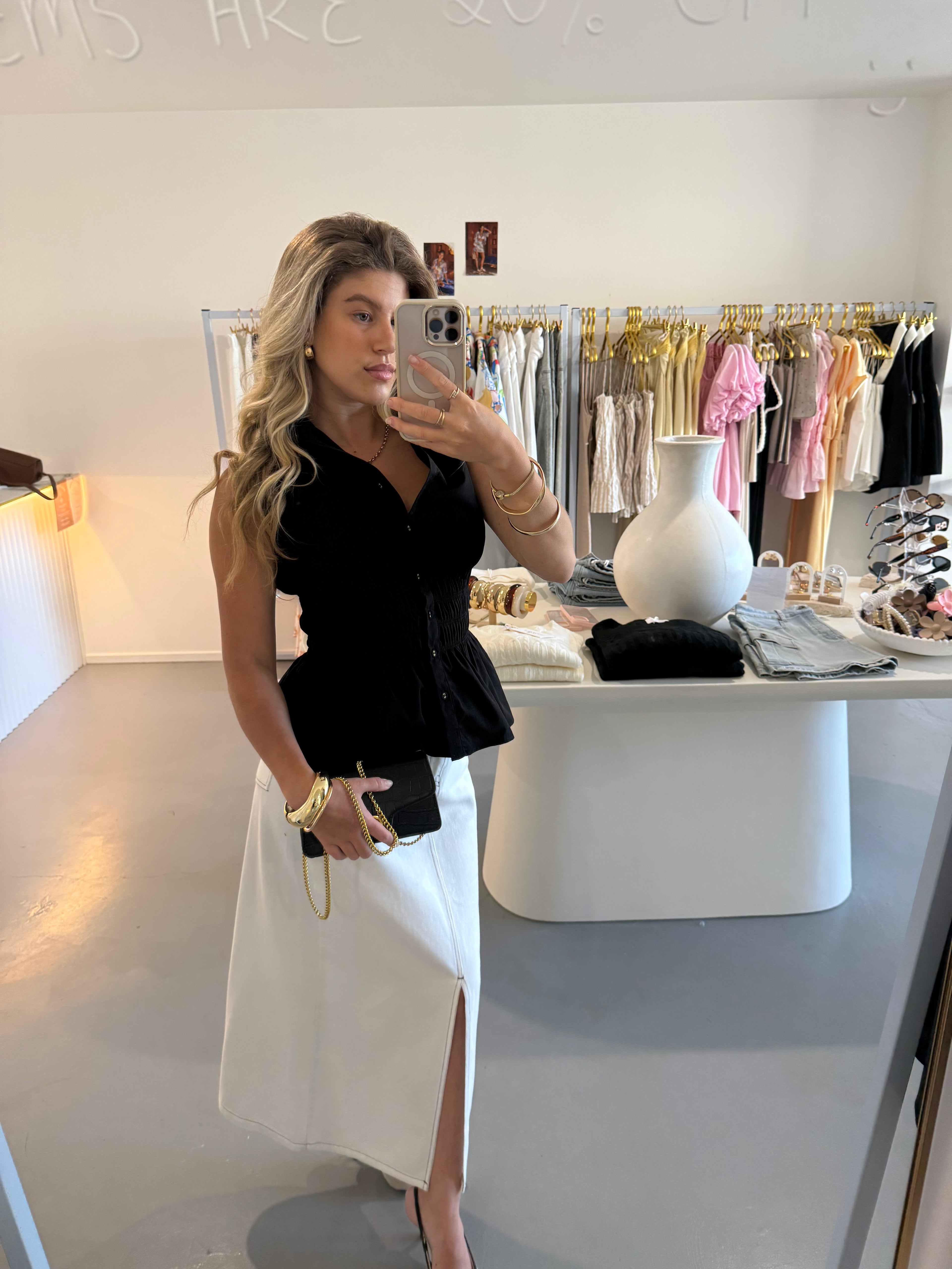 Black cinched waist sleeveless shirt