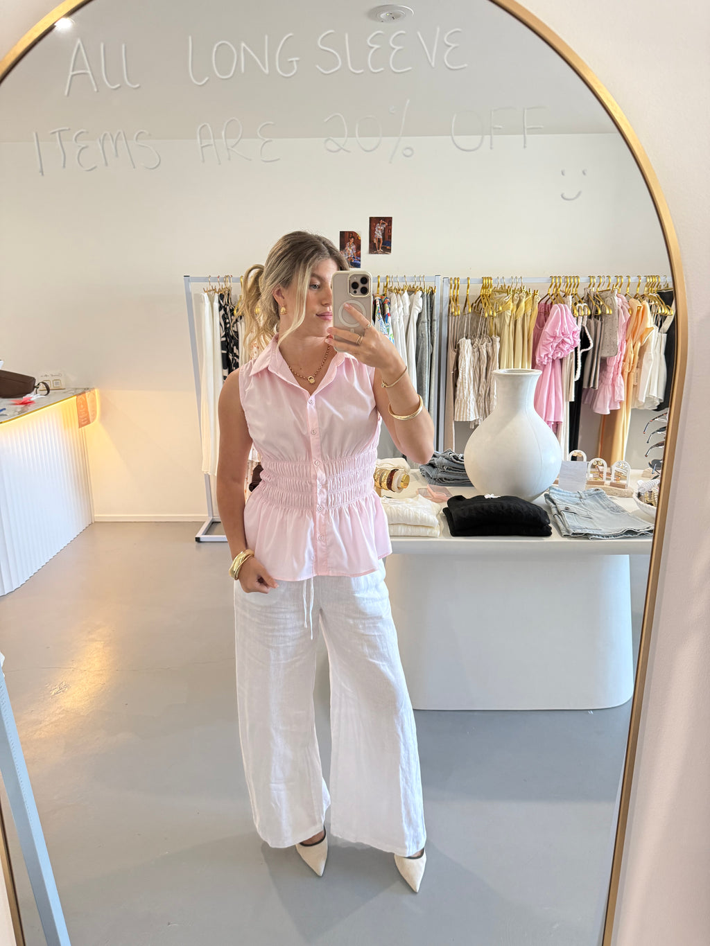 Pink cinched waist sleeveless top