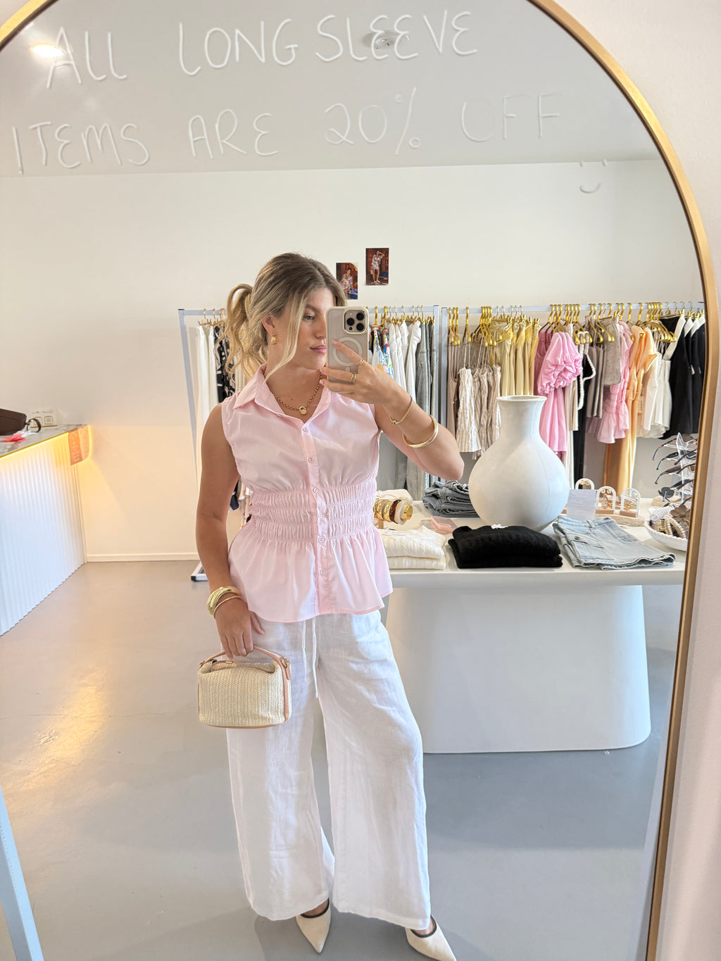 Pink cinched waist sleeveless top