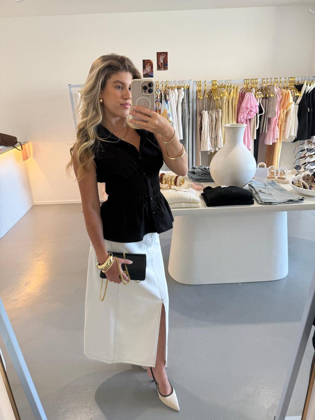 Black cinched waist sleeveless shirt