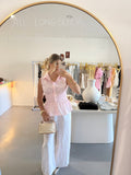 Pink cinched waist sleeveless top