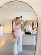 Pink cinched waist sleeveless top