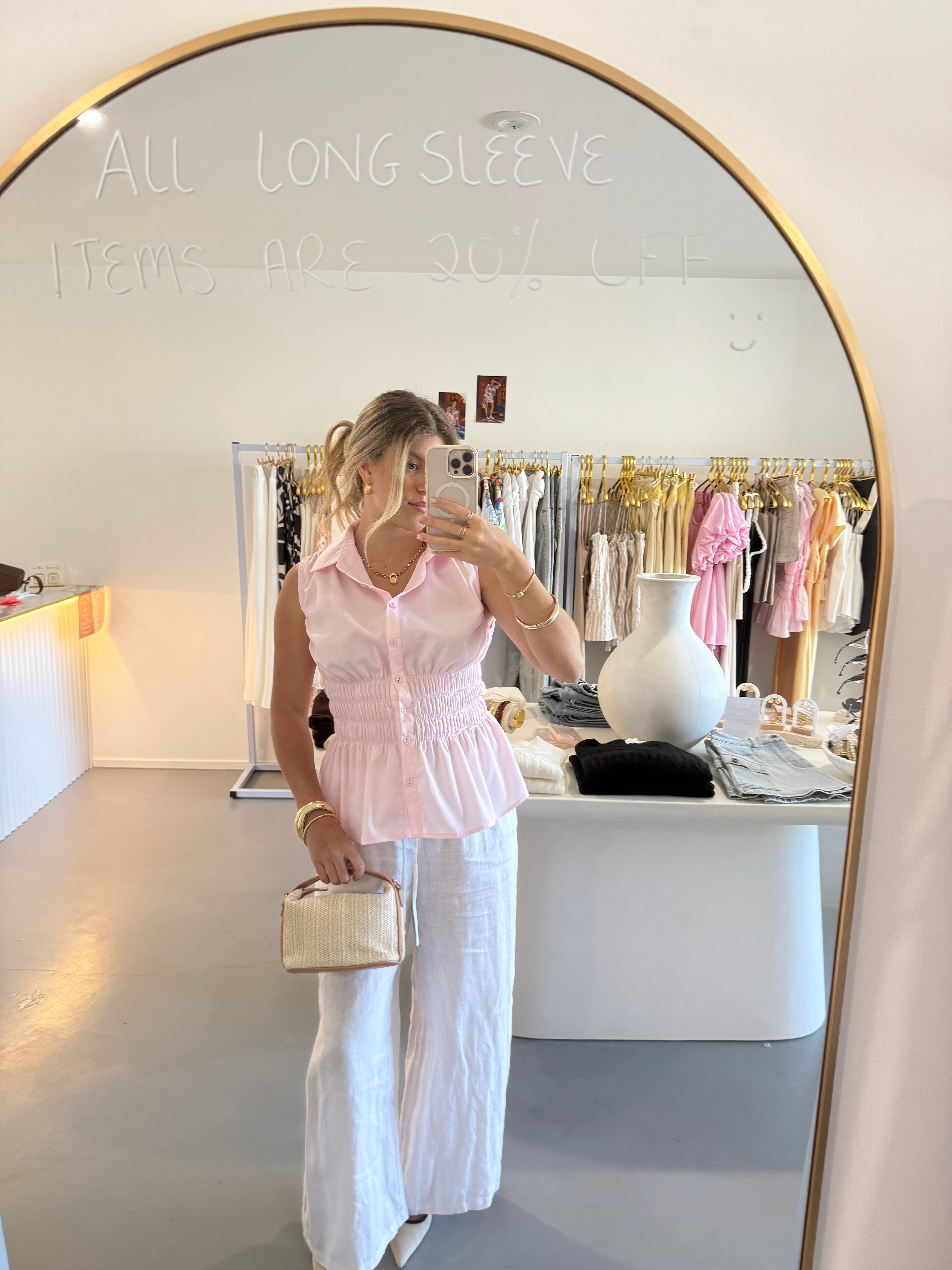 Pink cinched waist sleeveless top