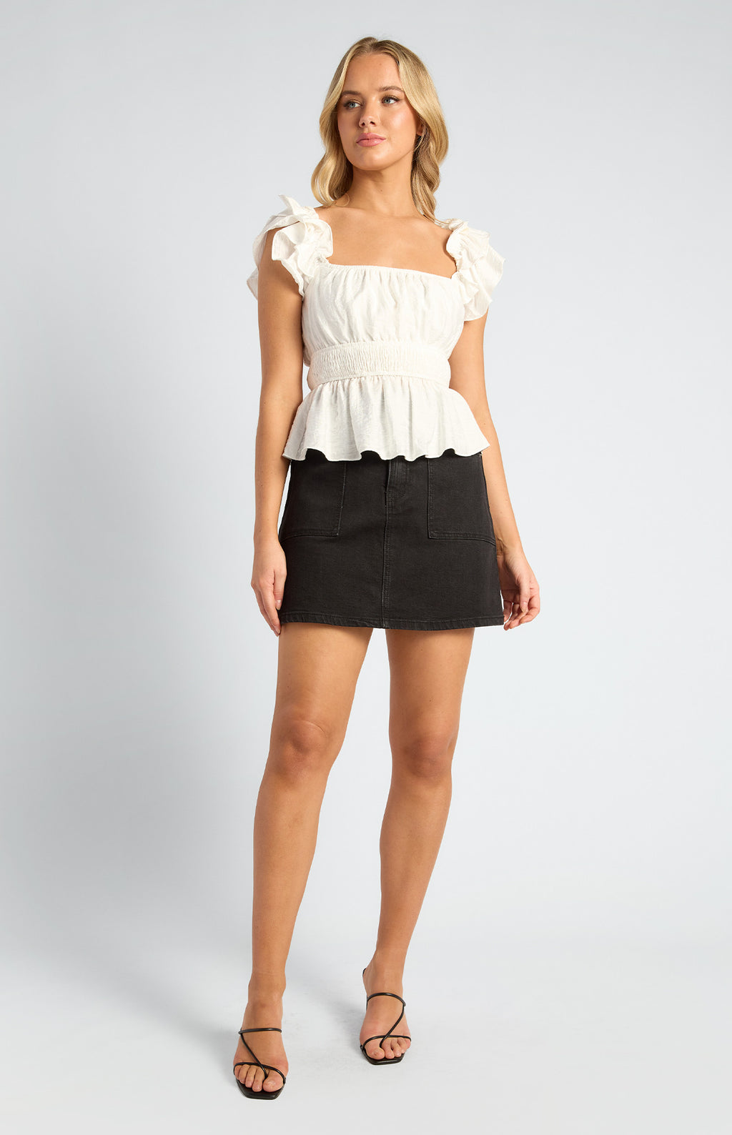 Black denim mini skirt